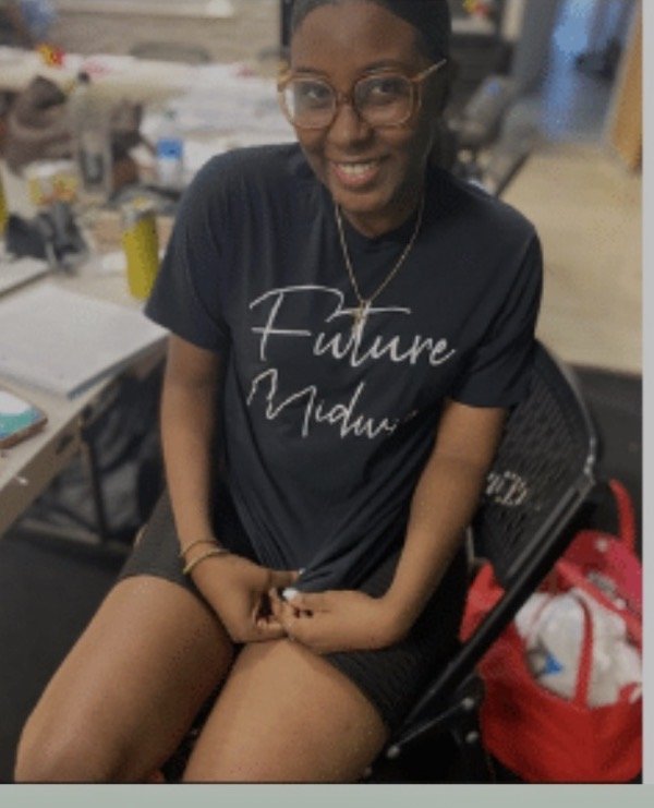 A smiling student midwife