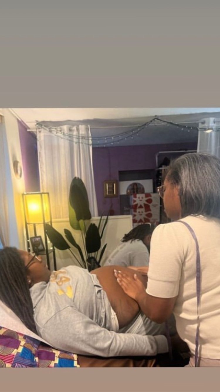 A midwife during a prenatal visit